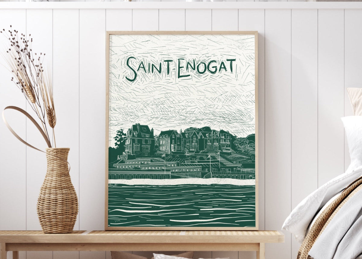 affiche de Saint-Enogat au format 70x100 cm positionnée dans un cadre bois et posée sur un banc près d'un lit